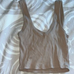 Garage crop top in a beige colour. Low neckline but very flattering.